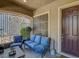 Inviting front porch with comfortable seating and a view of the landscaped yard at 3310 Hillside Garden Dr, Las Vegas, NV 89135