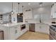 Well-lit kitchen featuring white cabinetry, stainless steel appliances, and quartz countertops at 3310 Hillside Garden Dr, Las Vegas, NV 89135