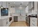 Contemporary kitchen features stainless steel appliances, quartz countertops, and white cabinetry at 3310 Hillside Garden Dr, Las Vegas, NV 89135