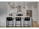 Modern kitchen featuring stainless steel appliances, quartz countertops and center island at 3310 Hillside Garden Dr, Las Vegas, NV 89135