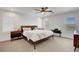 Bright main bedroom features neutral carpeting, ceiling fan, and windows with plantation shutters at 3310 Hillside Garden Dr, Las Vegas, NV 89135