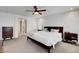 Bright main bedroom with carpet flooring, ceiling fan, and modern dresser at 3310 Hillside Garden Dr, Las Vegas, NV 89135