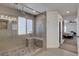 Modern tiled shower with a glass enclosure and pebble floor at 3310 Hillside Garden Dr, Las Vegas, NV 89135