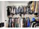 Walk-in closet contains metal racks with hung clothing at 3310 Hillside Garden Dr, Las Vegas, NV 89135