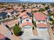 Aerial view showcases the home's roof, landscaping, and neighborhood in a vibrant community at 3632 Julia Waldene Ct, Las Vegas, NV 89129