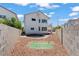 Backyard view with block wall, rock landscaping, and a green space on the grounds at 3632 Julia Waldene Ct, Las Vegas, NV 89129