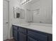 Bathroom featuring a modern vanity and mirrored cabinet at 3632 Julia Waldene Ct, Las Vegas, NV 89129