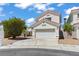 Lovely two-story house featuring a two-car garage and landscaped front yard in a sunny setting at 3632 Julia Waldene Ct, Las Vegas, NV 89129