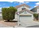 Charming two-story home featuring a two-car garage and a well-maintained front yard with mature landscaping at 3632 Julia Waldene Ct, Las Vegas, NV 89129