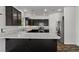 Stylish kitchen with stainless steel appliances, granite countertops, and dark wood cabinets at 3632 Julia Waldene Ct, Las Vegas, NV 89129