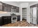 Beautiful kitchen featuring stainless appliances, dark cabinets, and a walk in pantry at 3632 Julia Waldene Ct, Las Vegas, NV 89129
