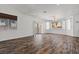 Spacious living room with wood-look flooring, natural light, and modern fixtures at 3632 Julia Waldene Ct, Las Vegas, NV 89129