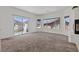 Bright living room with large sliding glass doors leading to outdoor space at 3632 Julia Waldene Ct, Las Vegas, NV 89129