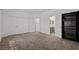 Large main bedroom with carpet flooring, closet, adjacent bathroom, and built-in shelves at 3632 Julia Waldene Ct, Las Vegas, NV 89129