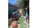 Untidy backyard with artificial turf and various stored items at 4238 Rollingstone Dr, Las Vegas, NV 89103