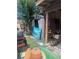 Unkempt backyard area with outdoor storage shed and miscellaneous items at 4238 Rollingstone Dr, Las Vegas, NV 89103