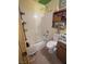 Bathroom featuring a bathtub, toilet, tiled wall, and vanity at 4238 Rollingstone Dr, Las Vegas, NV 89103