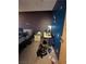 Interior shot of a bedroom with a bed, a nightstand and stained blue wall at 4238 Rollingstone Dr, Las Vegas, NV 89103
