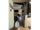 Shot of a hallway leading to a disorganized living area, showing clutter and decor at 4238 Rollingstone Dr, Las Vegas, NV 89103