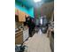 Kitchen with basic appliances and wooden cabinetry, with a view of the adjacent living space at 4238 Rollingstone Dr, Las Vegas, NV 89103
