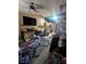 Open-concept floor plan showcasing the living room leading into the kitchen area at 4238 Rollingstone Dr, Las Vegas, NV 89103