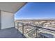 Balcony view showcases the city skyline and distant mountains, framed by a glass railing and blue skies at 4381 W Flamingo Rd # 1905, Las Vegas, NV 89103