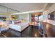 Modern bedroom with a king-size bed, workspace, kitchenette, and an elegant design at 4381 W Flamingo Rd # 1905, Las Vegas, NV 89103