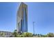 Modern high-rise building featuring sleek architecture and expansive windows under a clear blue sky at 4381 W Flamingo Rd # 1905, Las Vegas, NV 89103