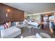 Open-concept living area with a sofa, bed, kitchenette, and sleek modern furnishings at 4381 W Flamingo Rd # 1905, Las Vegas, NV 89103