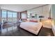 Bright living area featuring modern decor, including a bed, a sitting area, and scenic city views at 4381 W Flamingo Rd # 1905, Las Vegas, NV 89103