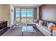Inviting living room with comfortable seating and panoramic city views from large windows at 4381 W Flamingo Rd # 1905, Las Vegas, NV 89103