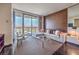 Stylish living room with a comfortable sectional sofa and floor-to-ceiling windows showcasing city views at 4381 W Flamingo Rd # 1905, Las Vegas, NV 89103