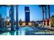 Inviting outdoor pool area with lounge chairs, palm trees, and views of the Palms building at 4381 W Flamingo Rd # 1905, Las Vegas, NV 89103