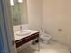 Clean bathroom featuring white marble floors, a modern vanity, and a toilet at 4471 Dean Martin Dr # 1104, Las Vegas, NV 89103