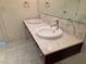 Bathroom featuring double sinks, marble countertops and floors, and modern chrome fixtures at 4471 Dean Martin Dr # 1104, Las Vegas, NV 89103