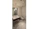 Modern bathroom featuring marble floors, a floating vanity with marble countertop, and a glass-enclosed shower at 4471 Dean Martin Dr # 1104, Las Vegas, NV 89103