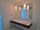 Bathroom featuring double sinks, marble countertops and floors, and modern pendant lighting at 4471 Dean Martin Dr # 1104, Las Vegas, NV 89103