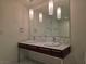 Bathroom featuring double sinks, marble countertops and floors, and modern pendant lighting at 4471 Dean Martin Dr # 1104, Las Vegas, NV 89103