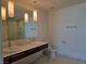 Bathroom featuring double sinks, marble countertops and floors, and modern pendant lighting at 4471 Dean Martin Dr # 1104, Las Vegas, NV 89103