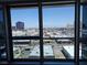 Condo window view overlooking vibrant city skyline with buildings, streets and blue sky at 4471 Dean Martin Dr # 1104, Las Vegas, NV 89103