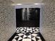 Stylish hallway featuring unique black and white patterned walls and black and white tile floors at 4471 Dean Martin Dr # 1104, Las Vegas, NV 89103