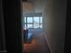 Hallway view to kitchen and cityscape through large windows at 4471 Dean Martin Dr # 1104, Las Vegas, NV 89103