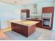 Modern kitchen featuring a large island, stainless steel appliances, and dark wood cabinetry at 4471 Dean Martin Dr # 1104, Las Vegas, NV 89103