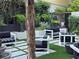 Stylish outdoor lounge area featuring modern furniture, lush landscaping, and a serene ambiance at 4471 Dean Martin Dr # 1104, Las Vegas, NV 89103