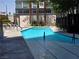 Swimming pool with tall trees and a building exterior in the background at 4471 Dean Martin Dr # 1104, Las Vegas, NV 89103