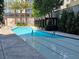 Swimming pool with trees and the exterior of the building in the background at 4471 Dean Martin Dr # 1104, Las Vegas, NV 89103