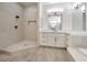 Bathroom with a tiled walk-in shower and vanity at 4664 Stuttgart St, Las Vegas, NV 89147