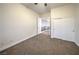 This bedroom features neutral walls, carpeted floors, ceiling fan and a closet for optimal storage space at 4664 Stuttgart St, Las Vegas, NV 89147
