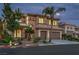 Stunning two-story home showcasing desert landscaping, a tile roof, and a three-car garage for ample parking at 4664 Stuttgart St, Las Vegas, NV 89147