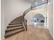 Grand foyer with winding staircase and open-concept living area at 4664 Stuttgart St, Las Vegas, NV 89147